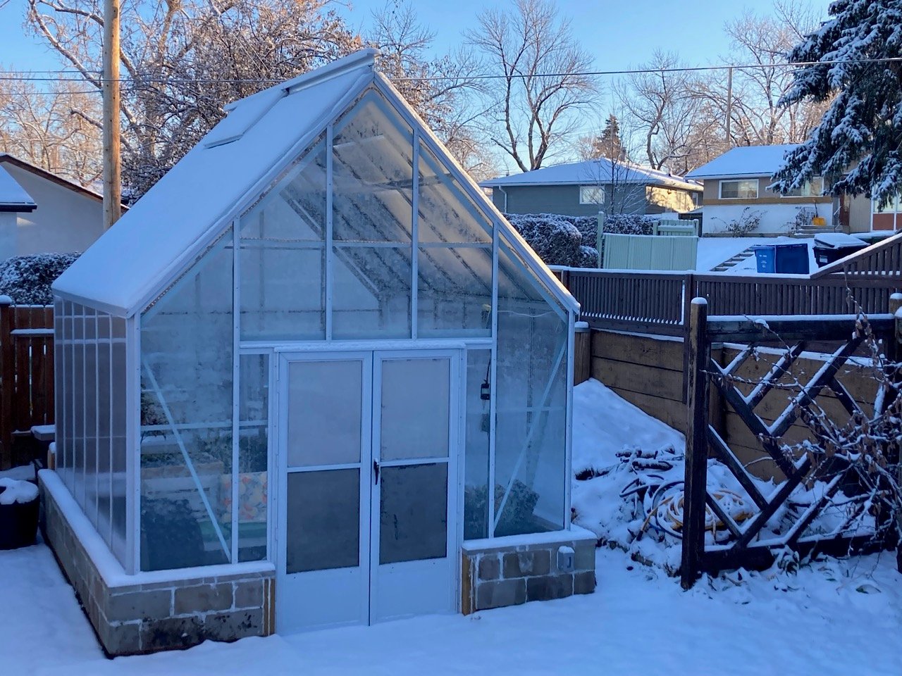Cape Cod greenhouse with dusting of snow