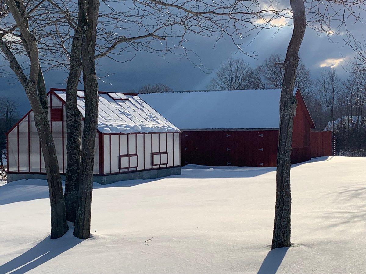 Red Framed Greenhouse in Snow